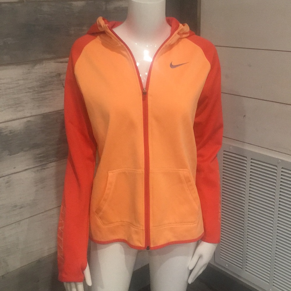 Nike hooded jacket with pockets and thumb holes.